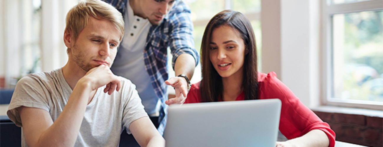 Group of teenage students discussing new educational video course at break