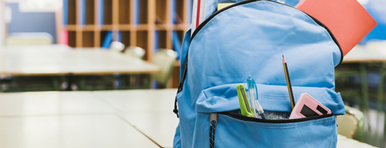 blue-schoolchild-backpack-table